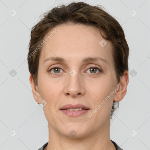 Joyful white adult female with short  brown hair and grey eyes