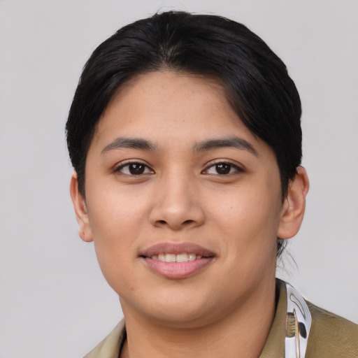 Joyful asian young-adult female with short  black hair and brown eyes
