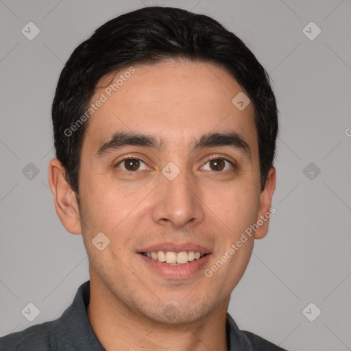 Joyful white young-adult male with short  black hair and brown eyes