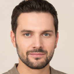 Joyful white young-adult male with short  brown hair and brown eyes