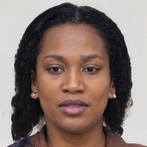 Neutral black young-adult female with long  black hair and brown eyes