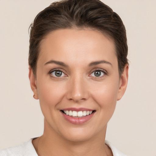 Joyful white young-adult female with short  brown hair and brown eyes