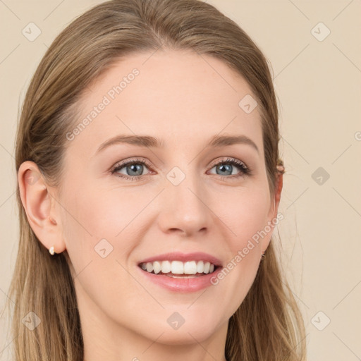 Joyful white young-adult female with long  brown hair and blue eyes