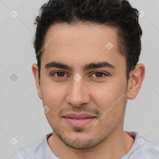 Joyful white young-adult male with short  brown hair and brown eyes