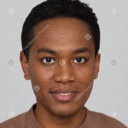 Joyful black young-adult male with short  brown hair and brown eyes