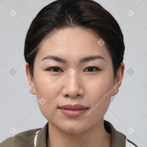 Joyful asian young-adult female with short  brown hair and brown eyes