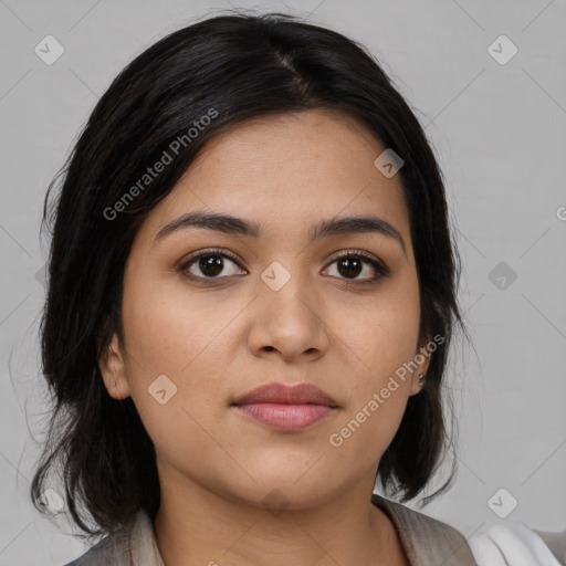 Joyful latino young-adult female with medium  black hair and brown eyes