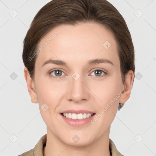 Joyful white young-adult female with short  brown hair and grey eyes