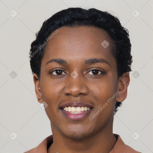 Joyful black young-adult female with short  black hair and brown eyes