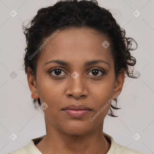 Joyful black young-adult female with short  brown hair and brown eyes