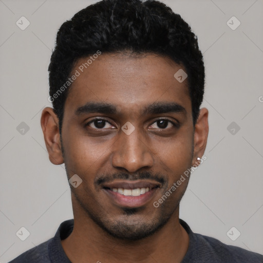Joyful black young-adult male with short  black hair and brown eyes