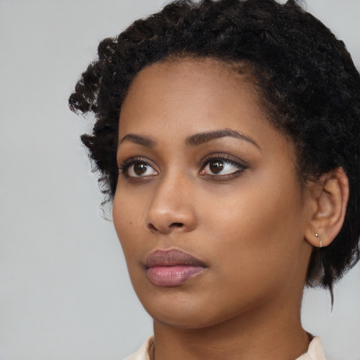 Neutral black young-adult female with medium  black hair and brown eyes