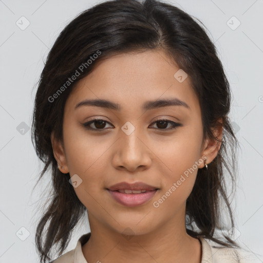 Joyful latino young-adult female with medium  brown hair and brown eyes