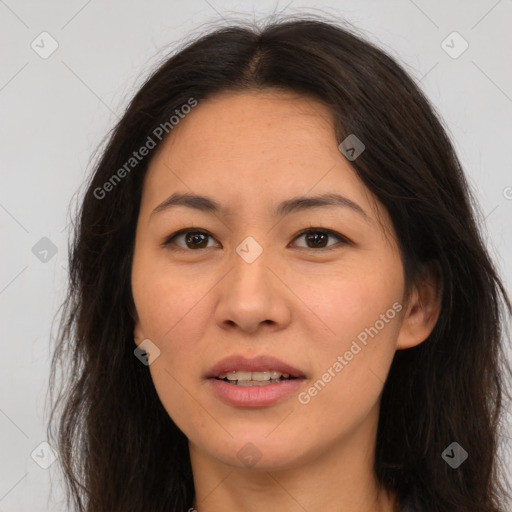 Joyful white adult female with long  brown hair and brown eyes