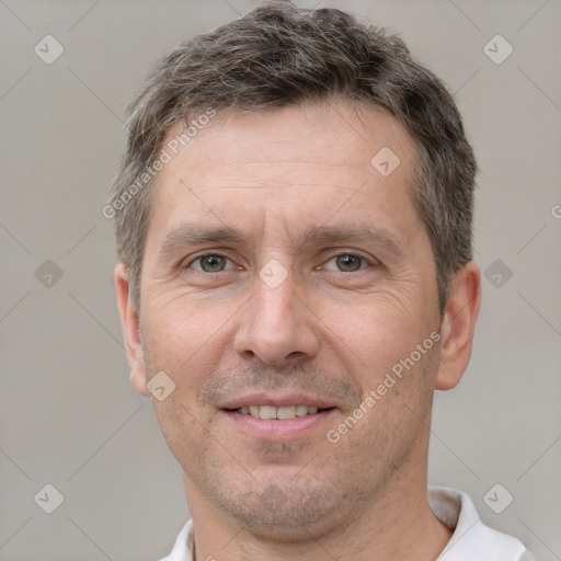 Joyful white adult male with short  brown hair and brown eyes