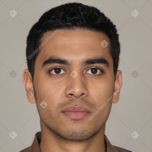 Joyful latino young-adult male with short  black hair and brown eyes