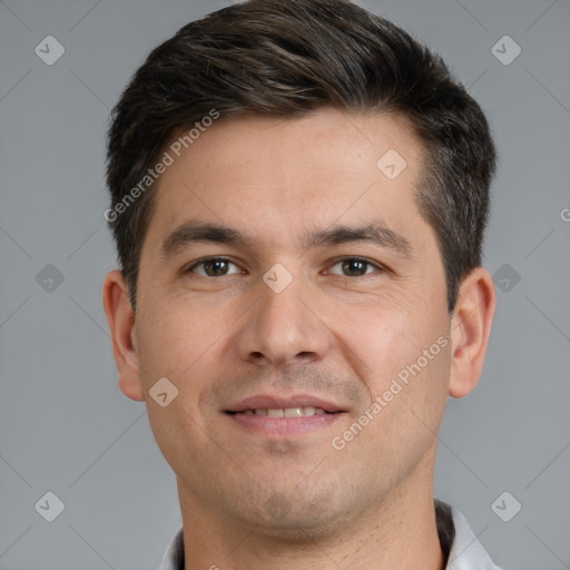 Joyful white young-adult male with short  brown hair and brown eyes