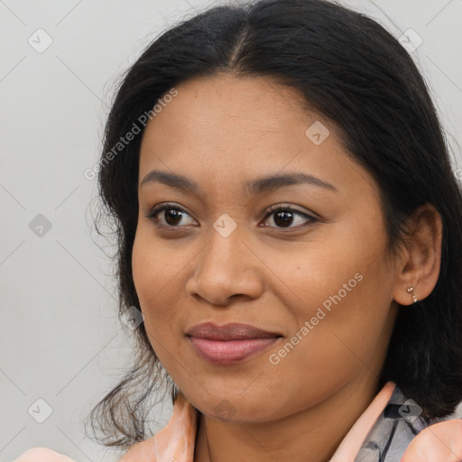 Joyful latino young-adult female with long  brown hair and brown eyes