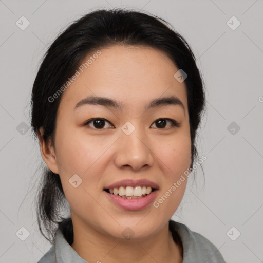 Joyful asian young-adult female with medium  black hair and brown eyes