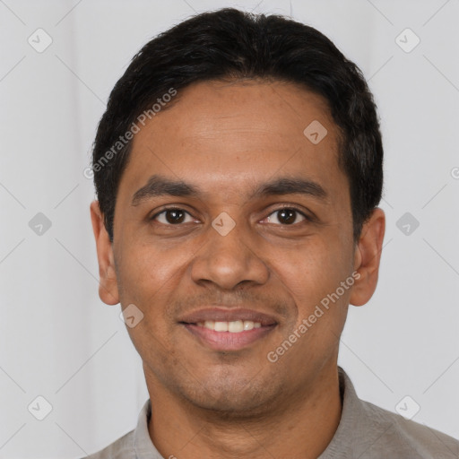 Joyful latino young-adult male with short  black hair and brown eyes