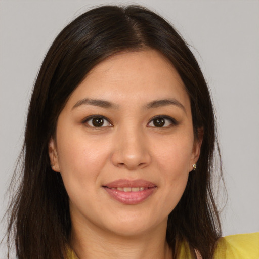 Joyful white young-adult female with medium  brown hair and brown eyes