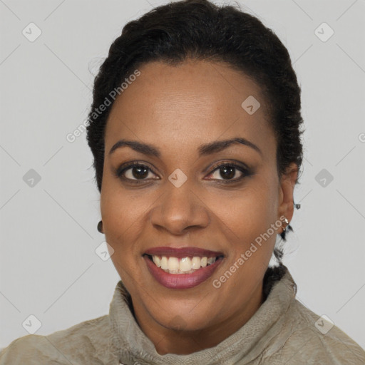 Joyful black young-adult female with long  brown hair and brown eyes