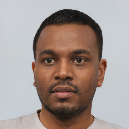 Neutral black young-adult male with short  black hair and brown eyes