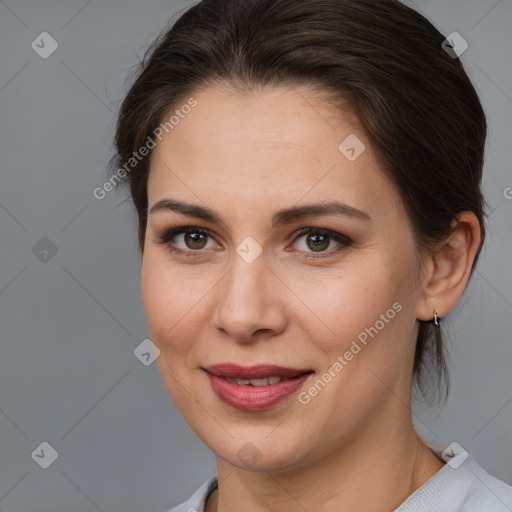 Joyful white adult female with medium  brown hair and brown eyes