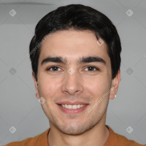 Joyful white young-adult male with short  black hair and brown eyes