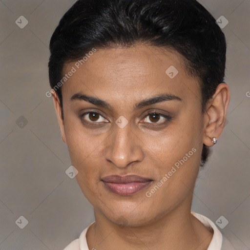 Joyful latino young-adult female with short  brown hair and brown eyes