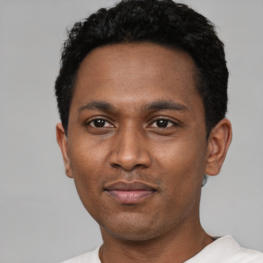 Neutral black young-adult male with short  black hair and brown eyes