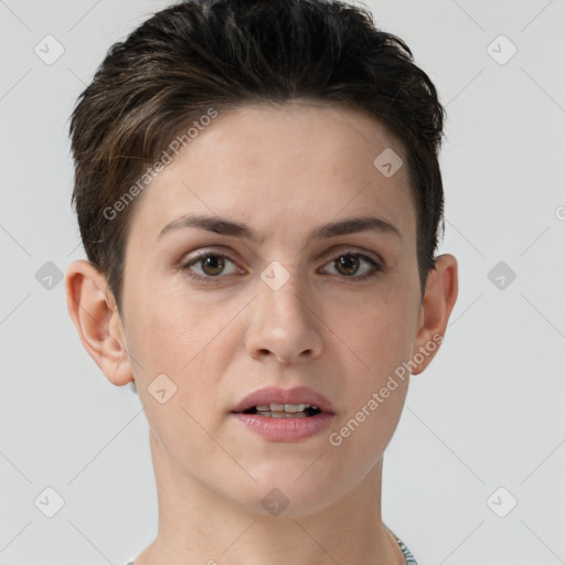 Joyful white young-adult female with short  brown hair and brown eyes