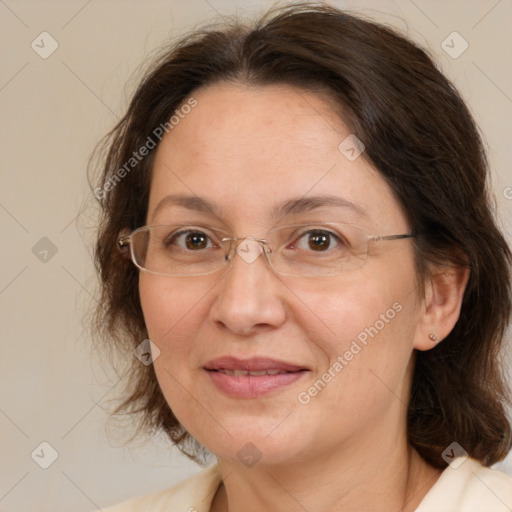 Joyful white adult female with medium  brown hair and brown eyes