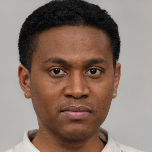 Neutral black young-adult male with short  black hair and brown eyes