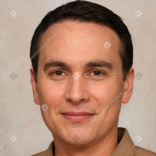 Joyful white adult male with short  brown hair and brown eyes