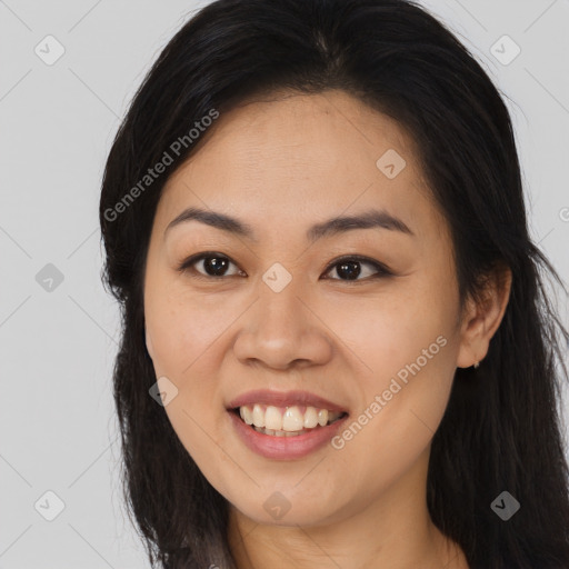 Joyful asian young-adult female with long  brown hair and brown eyes