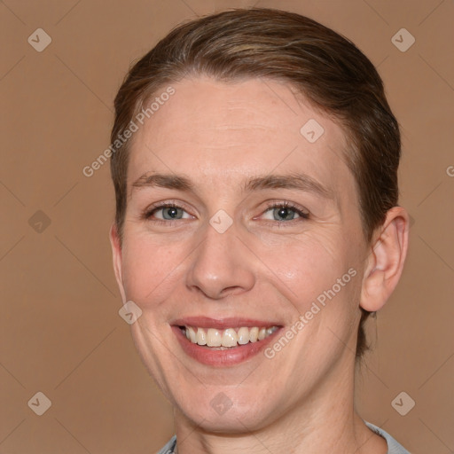 Joyful white adult female with medium  brown hair and grey eyes