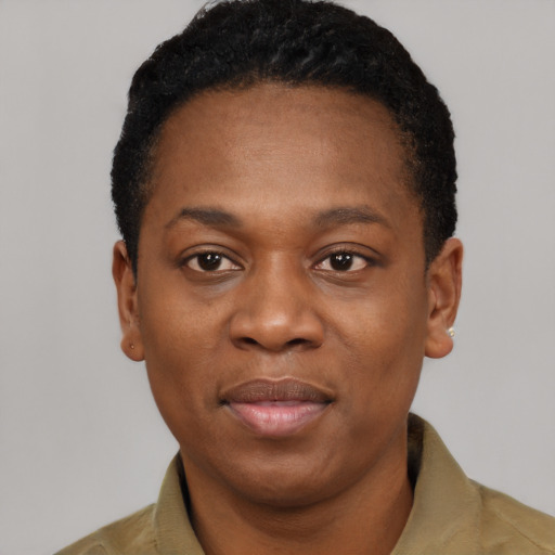 Joyful black young-adult male with short  black hair and brown eyes