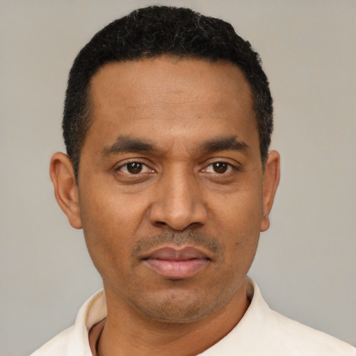 Neutral latino adult male with short  black hair and brown eyes