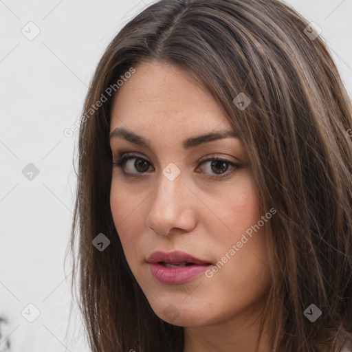 Neutral white young-adult female with long  brown hair and brown eyes