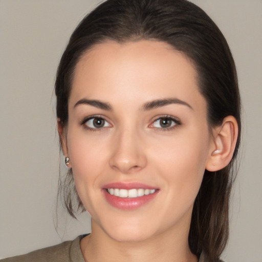 Joyful white young-adult female with medium  brown hair and brown eyes