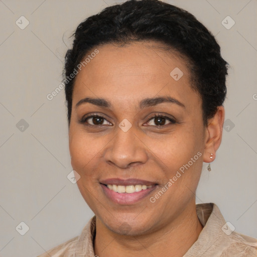 Joyful latino young-adult female with short  black hair and brown eyes