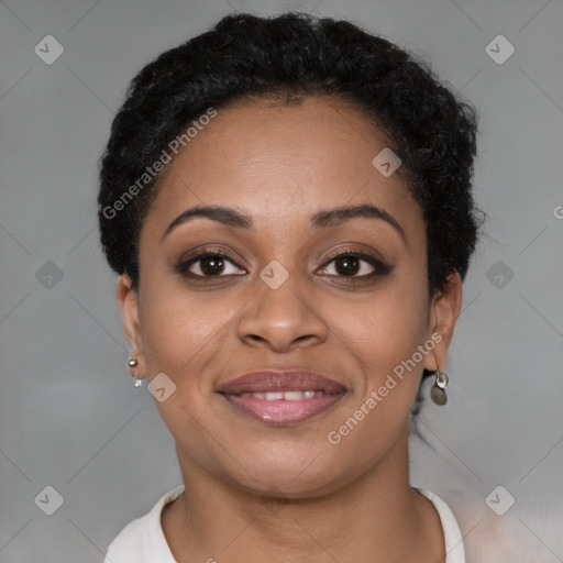 Joyful black young-adult female with short  brown hair and brown eyes