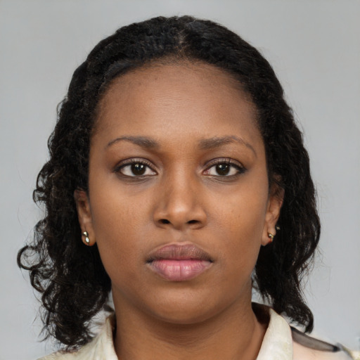Neutral black young-adult female with medium  black hair and brown eyes