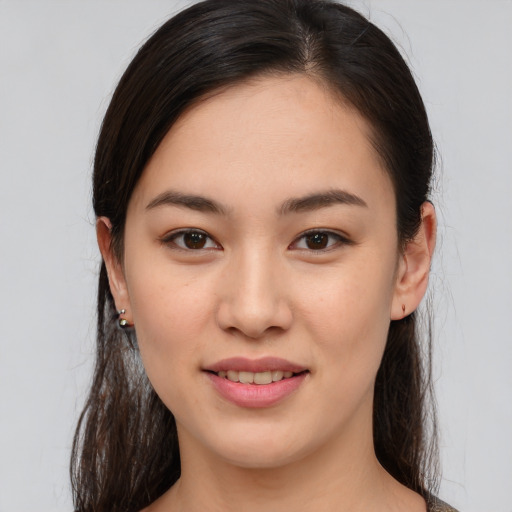 Joyful asian young-adult female with medium  brown hair and brown eyes