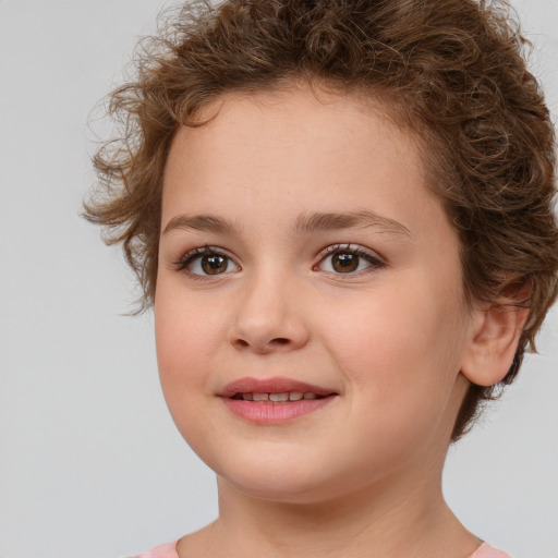 Joyful white child female with short  brown hair and brown eyes