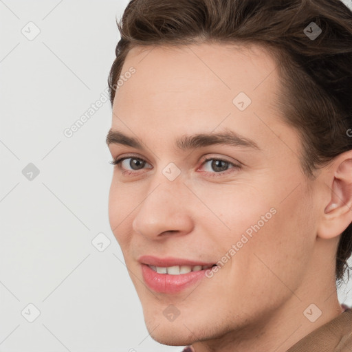 Joyful white young-adult male with medium  brown hair and brown eyes