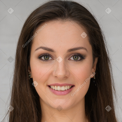 Joyful white young-adult female with long  brown hair and green eyes