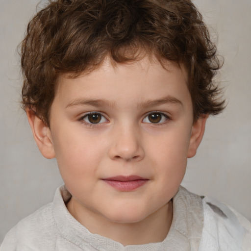 Joyful white child male with short  brown hair and brown eyes