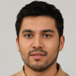 Neutral latino young-adult male with short  black hair and brown eyes